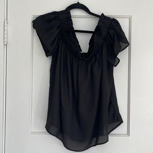 Black ruffled, off the shoulder boxy and flowy top, great with wide leg jeans